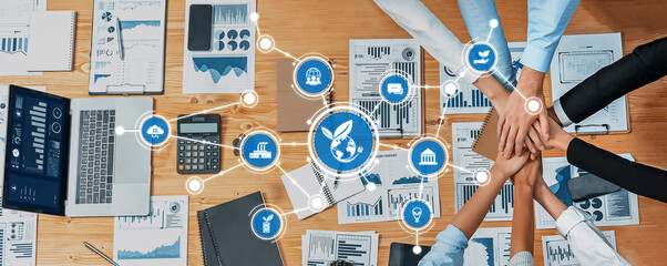 Poster - Aerial view of diverse business professionals collaborating over data charts and digital tools, fostering innovation and sustainable growth in a modern workspace. Amity
