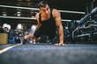 © Miljan Živković - young adult man bodybuilder doing push ups exercise training in the gym