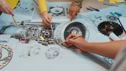Poster - Engineers engage in a detailed analysis of mechanical components and technical drawings, showcasing collaboration and creativity in an innovative workshop setting. SACTR