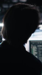 Poster - Vertical video Data center software developer using computer to monitor neural network AI LLM visualization. Worker in high tech facility using PC to oversee servers powering machine learning
