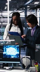Aufkleber - Vertical video Team of data center engineers looking over paperwork and using deep learning algorithms to analyze datasets. Employees in multiethnic server farm using AI to recognize data patterns