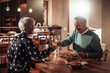 © Marko Geber - Middle aged couple enjoying romantic dinner and wine at home together