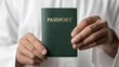 © Yoan Maulana Studio - Close-Up of a Muslim Hand Holding a Green Passport – Suitable for Blog Posts, Social Media, and Website Content Related to Travel and Tourism