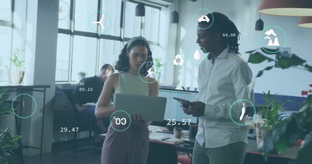 Poster - Opening laptop, woman and man analyzing sustainability data in office, animated icons updating