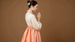 © very ordinary - Traditional Korean woman in hanbok praying, side profile, peaceful Asian culture portrait, elegant hanbok dress, Korean tradition, cultural heritage, meditation, graceful posture, beauty and spiritual