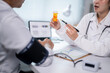 © Apichat - A doctor is talking to a patient about a prescription