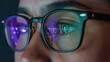© Audtakorn - Eye with Glasses and Reflection: Close-up of an eye wearing glasses with an immersive reflection, a glimpse into the digital world. Capturing the intensity of focus.
