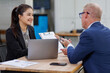 © David - Group of confident business people point to graphs and charts to analyze market data, balance sheet, account, net profit to plan new sales strategies to increase production capacity.