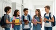 © MST - Diverse group of happy elementary students in school hallway