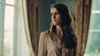 © Elena - Elegant brunette woman with soft waves in a beige blouse gazing thoughtfully into the distance during natural light session with a muted background and copy space