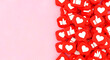 © Grafix71 - Pile of red social media like and heart icons on pink background image