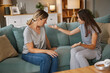 © Stockphotodirectors - Teen girl expresses her thoughts and emotions to her mother in a cozy living room. The two women engage in a serious conversation on teenage issues that are affecting their relationship.