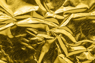Wall Mural - luxury shiny metallic golden foil crumpled texture background