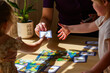 © Austockphoto - allied health professional speech therapist using cards for speech development