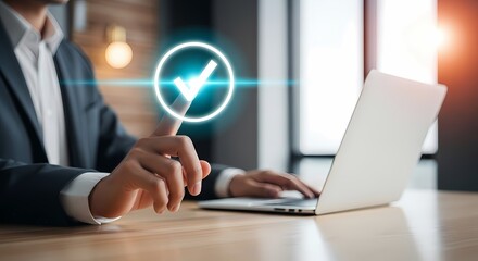 Businessman touching check mark icon on laptop screen
