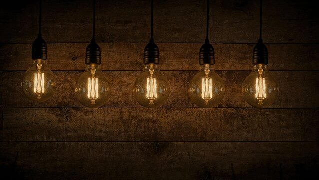 Bright Bulbs Set On A Wooden Background With Sharp Selective Focus, Suitable For Reports, Wallpapers, And Placards