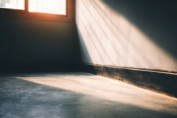 Aufkleber - Minimal hallway corner with bright sunlight streaming through window, casting dramatic shadow on concrete floor and textured wall, creating calm and peaceful atmosphere