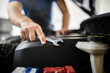 © zphoto83 - Car mechanic working on engine with wrench during vehicle maintenance in garage