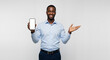 © DEGE - Smiling African American Businessman Proudly Displays Mobile Phone with Blank Screen for Your Business Presentation