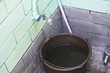 © Olga - a beautiful bucket of water under the tap in the garden