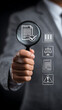 © Rashed - Person holding magnifying glass over document with icons for legal compliance and risk assessment