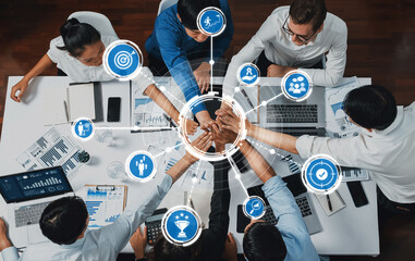 Poster - Top view diverse office worker join hand together in office room symbolize business synergy and strong productive teamwork in workplace. Cooperation and unity between business employee. Prudent Amity