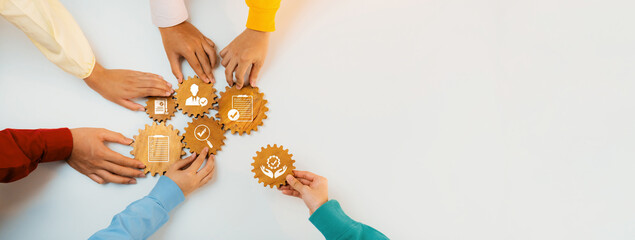 Poster - The image captures diverse hands collaborating over gear symbols, representing teamwork and strategic business process optimization for enhanced efficiency and solutions. Amity