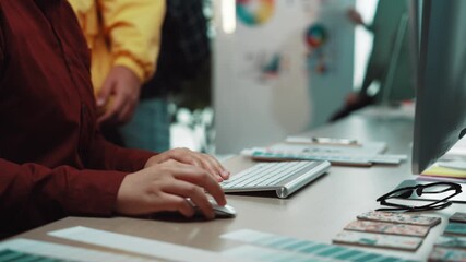 Poster - A modern office scene showcasing hands engaged with a color palette and digital device, reflecting creativity, teamwork, and a dynamic work environment. SACTR