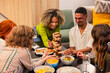 © ADDICTIVE STOCK - Friends enjoying a game night with food and laughter