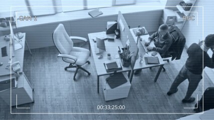 Wall Mural - Security camera footage of male manager walking around office room equipped with partitioned desk talking on smartphone then passing phone to colleague during business planning conversation