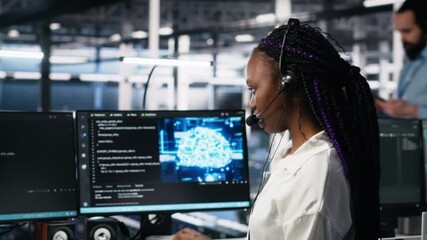 Poster - Data center computer scientist using AI assistant to provide user technical support. African american woman in server farm managing live support calls assisted by artificial intelligence, camera A