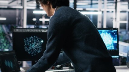 Poster - Technician arriving in data center office, coding with generative AI assistance. IT expert sitting at desk, starting work on artificial intelligence large language model solving tasks, camera A
