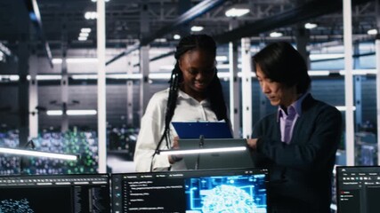 Poster - Team of data center engineers looking over paperwork and using deep learning algorithms to analyze datasets. Employees in multiethnic server farm using AI to recognize data patterns, camera A