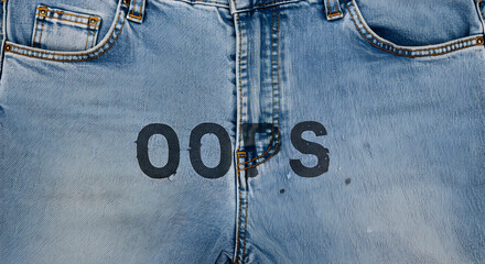 Aufkleber - Faded Blue Jeans with Distressed Pattern and the Text Oops Printed on The Denim Fabric Close Up Texture