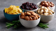 © MP-AI - Healthy keto diet nut snack assortment in bowls. Almond cashew and raisin for delicious and nutritious food choice