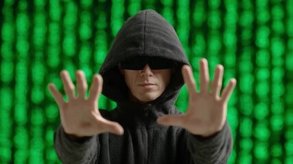 Poster - Digital Defender: A hooded figure, shielding themselves in a digital realm of binary code. The hands out in front evoke both defense and control. 