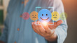 © LAONG - User holding blue paper cut happy smile face, Positive thinking, Mental health assessment, World mental health day concept, Positive feedback and reviews, great experience and service. emotion icon