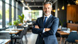 © Akun - Confident businessman restaurant portrait.