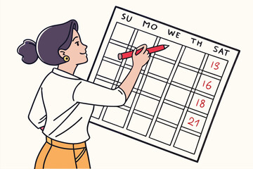 Poster - Woman planning her week using a calendar with dates marked in red while standing in a bright, organized workspace