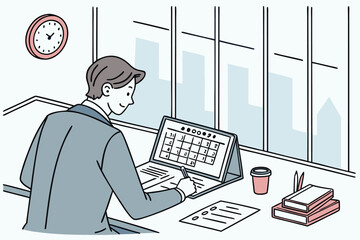 Poster - Professional man working at a desk with calendar and notebook in a modern office setting during the daytime