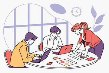 Poster - Team members collaborate on project plans at a modern office workspace with laptops and documents during a productive meeting in the afternoon