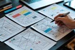 © Fahmida - UX Graphic designer planning wireframe layout with website mockups, user interface sketch templates, creative sketch planning application process development prototype wireframe for web mobile phone .