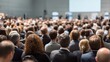 © Image4u - Large audience attending conference with focus on back of heads