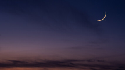Wall Mural - dusk sky crescent moon on twilight after sundown, religion of islamic well editing text ramadan kare