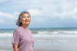 © Verin - portrait elegant asian senior woman relaxing at the beach,elderly pensioner lifestyle,travel,relaxation