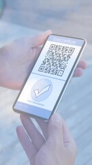 Poster - Animation of woman holding smartphone with covid 19 vaccination passport over cityscape