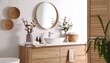 © Bagas - Modern, minimalist bathroom vanity with round mirror and natural decor