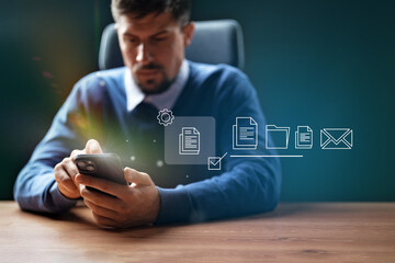 Poster - Professional man using smartphone to manage documents and communications in office environment