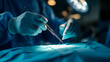 © DenShandy - Surgeon hands sewing surgical wound in operation