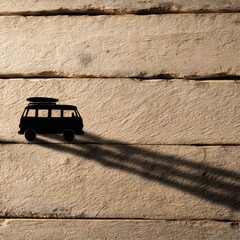 Poster - Silhouette of a camper van on a wooden surface.